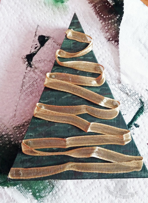 Re-purpose your holiday decor and make this Christmas tree from a wooden candy corn!