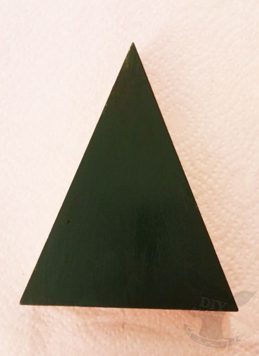 Re-purpose your holiday decor and make this Christmas tree from a wooden candy corn!