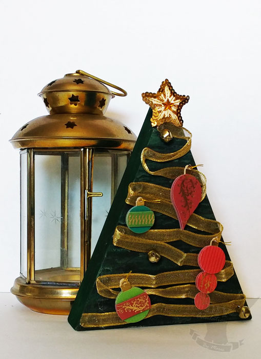 Re-purpose your holiday decor and make this Christmas tree from a wooden candy corn!