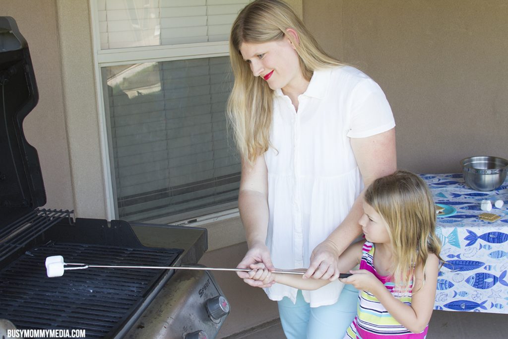 Making S'mores over a grill