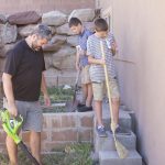 Boys working with dad